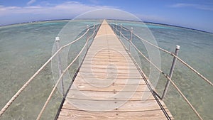 In vacation, walking along a pier on the sea - footage