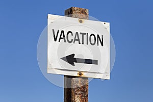 Vacation word and arrow signpost