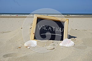 Vacation written on a board