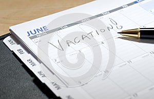 Vacation Written in June on a Calendar photo