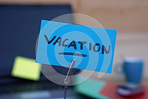 Vacation written on a memo