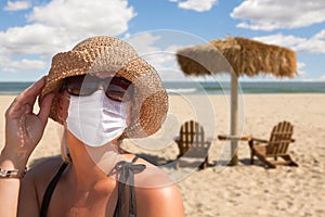 Vacationing Woman Wearing Face Mask on Sandy Beach