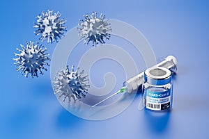 Vaccination against the new Corona Virus SARS-CoV-2: A glass container with 10 doses of vaccination and a syringe behind it