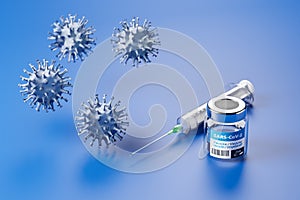 Vaccination against the new Corona Virus SARS-CoV-2: A glass container with 10 doses of vaccination and a syringe behind it photo