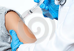 Vaccination. Doctor injecting flu vaccine to patient`s arm.