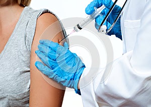 Vaccination. Doctor injecting flu vaccine to patient`s arm.