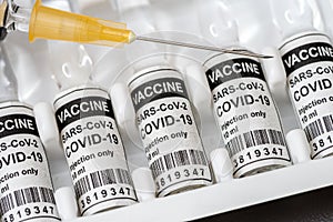 Vaccination with serum and syringe against COVID-19