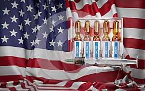 Vaccination in USA concept. Syrringe and vials with vaccine on USA  flag