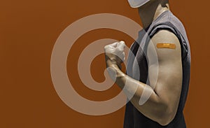 Vaccinations, bandage plaster on vaccinated people`s arm concept.