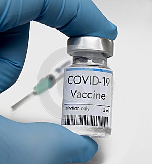 Vaccine against coronavirus COVID-19 in vial at Pfizer medical laboratory photo