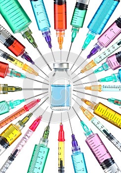 Vaccine cure concept. Drug vial surrounded by colorful syringes with needles pointed towards vaccine