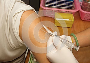 Vaccine injection into patient