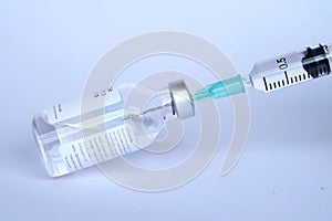 Vaccine and syringe