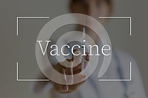 Vaccine text over image of a nurse holding an injection needle