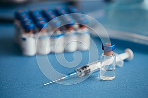 Vaccines bottles and syringe. Medical objects