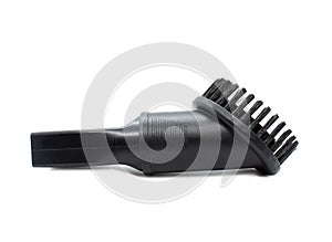 Vacuum cleaner brush. Plastic attachment for Furniture. Black Upholstery brush isolated on a white background. Side view.