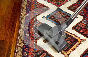 Vacuum Cleaner on a Carpet photo