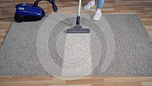 Vacuum cleaner close up cleaning dirty carpet