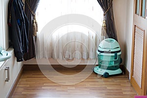 Vacuum cleaner at the room corner