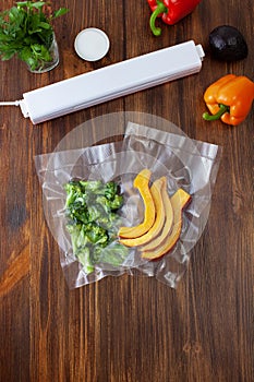 Vacuum cleaner with vacuum bags with broccoli and pumpkin slices