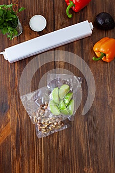 Vacuum cleaner with vacuum bags with slices of green apples and nuts