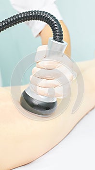 Vacuum massage device. Anti cellulite body correction treatment. Loss weight apparatus. Woman and doctor at medicine salon