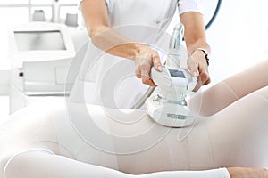 Vacuum massage. Endermology, abdominal vacuum massage. A woman`s body during a care treatment