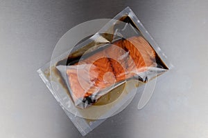 Vacuum-packed marinated salmon closeup