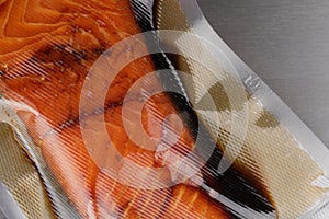 Vacuum-packed marinated salmon closeup