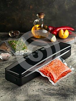 Vacuum packing machine. For long-term storage of food. Top view dark background