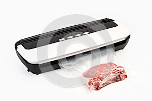Vacuum packing machine and meat in a plastic bag