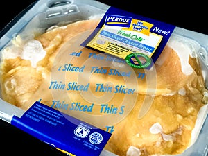 Package of Purdue Thin Sliced Chicken Breast.