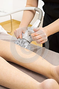 Vacuum slimming massage treatment at clinic