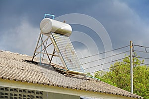 Vacuum solar water heating system on the house roof.