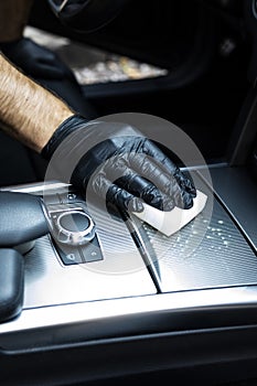 Vacuuming the car, cleaning the interior of the car with a microfiber cloth