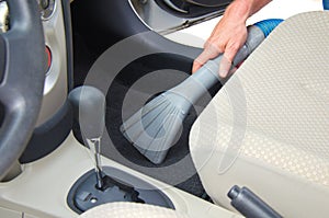 Vacuuming a car interior automobile detailing