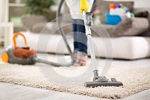 Vacuuming carpet photo