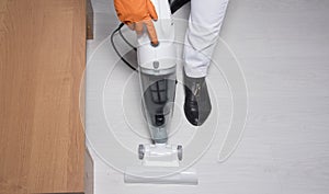 Vacuuming floor. Domestic home cleaning. Cleaning service concept at home, apartments, hotel