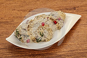 Vagan dietary cusine - mutabal with granet seeds