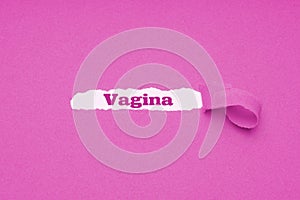 Vagina word revealed underneath torn pink paper