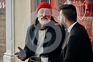 Vagrant tell about his life to businessman