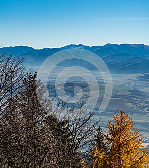 Vah river valley and highest parf of Nizke Tatry mountains from Predny Choc hill in Chocske vrchy mountains in Slovakia