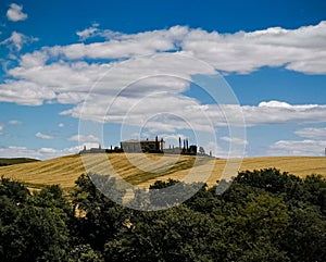 Val D& x27;orcia landscape with farm on a hill