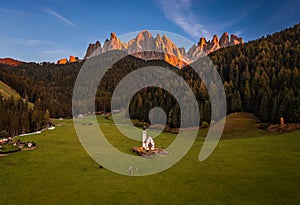 Val Di Funes, Dolomites, Italy - Aerial view of the beautiful St. Johann Church Chiesetta di San Giovanni in Ranui South Tyrol