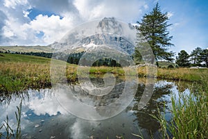 Val Gardena. Pond and reflection of Sassolungo Langkofel mountain. Dolomites, Italy