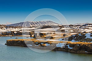 Valcano mount and lake in Myvatn Winter landscape