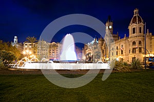 Valencia City Hall on Plaza del Ayuntamiento with colorful fount photo