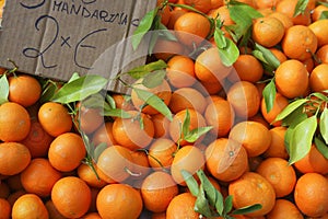 Valencia oranges stacked on market