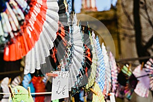 Valencia, Spain - February 24, 2019: Typical colorful Spanish flamenco fans for sale in a street market in spring