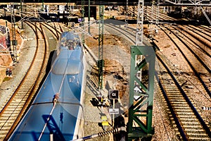 Valencia, Spain - January 12, 2019: Renfe train leaving the North station of Valencia on the tracks photo